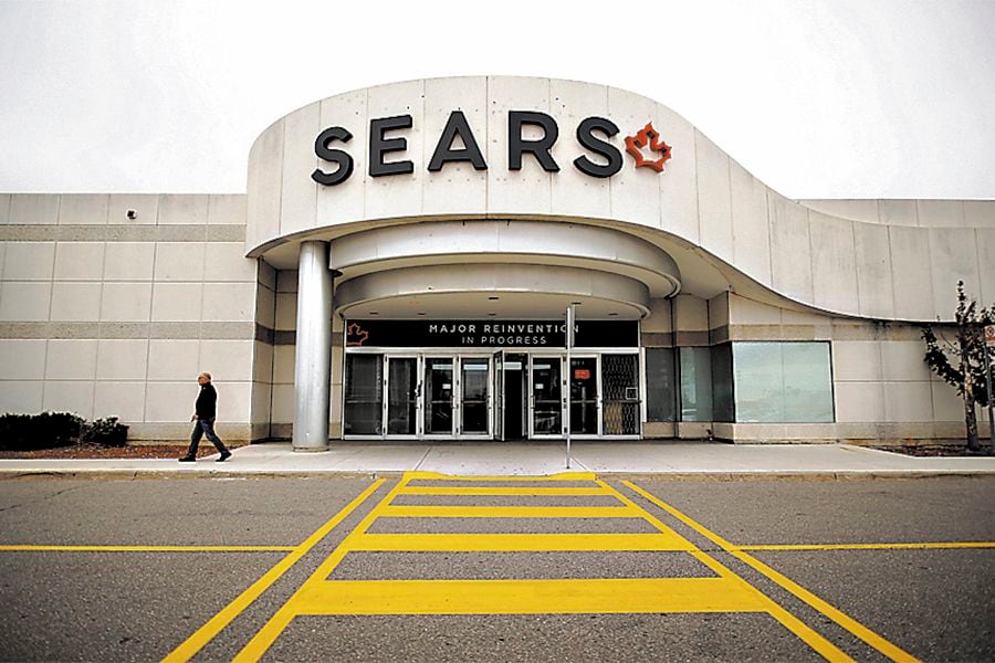 FILE PHOTO:    A man walks in front of a Sears store in Mississauga, Ontario