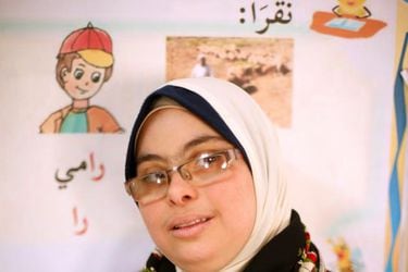 Hiba Al-Sharfa, a twenty seven-year-old Palestinian teacher aide with Down Syndrome poses for a photograph in a school at the Right to Live Society in Gaza City