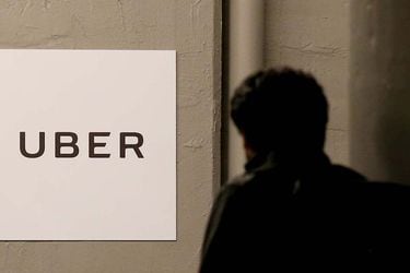 FILE PHOTO: A man arrives at the Uber offices in Queens, New York