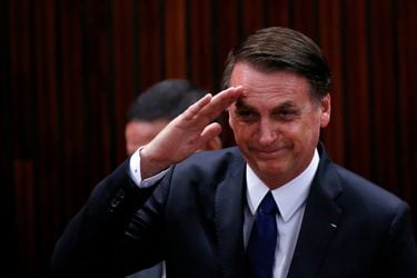 Brazil's President-elect Jair Bolsonaro salutes before receiving a confirmation of his victory in the recent presidential election in Brasilia