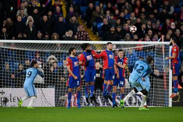 Manchester City's Yaya Toure scores their third goal from a free kick