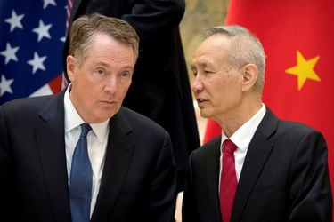 FILE PHOTO: FILE PHOTO: FILE PHOTO: U.S. Trade Representative Robert Lighthizer listens as Chinese Vice Premier Liu He talks while they line up for a group photo at the Diaoyutai State Guesthouse in Beijing