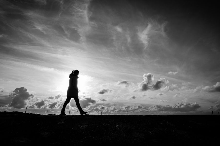 Walking alone - Howth, Ireland - Black and white street photogra