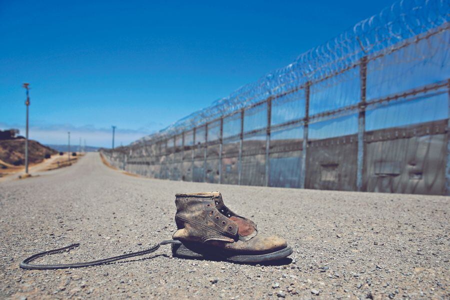 A shoe is left along a road in the enforcem (42276839)