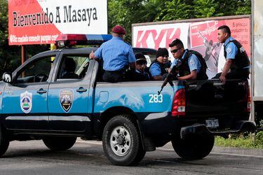 Police patrol the Pan-American highway after clashes with demonstrators in the indigenous community of Monimbo in Masaya