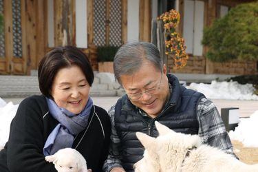 South Korean President Moon Jae-in and first lady Kim Jung-sook hold puppies born from a hunting dog gifted from North Korea, in Seoul