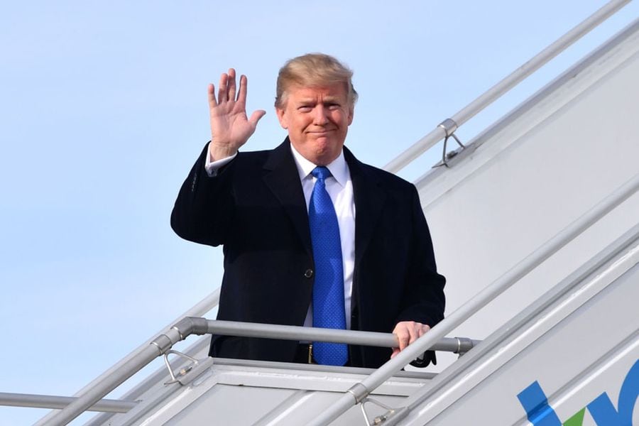 EDITORS NOTE: Graphic content / US President Donald Trump waves as he