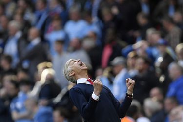 Arsenal manager Arsene Wenger celebrates after the match
