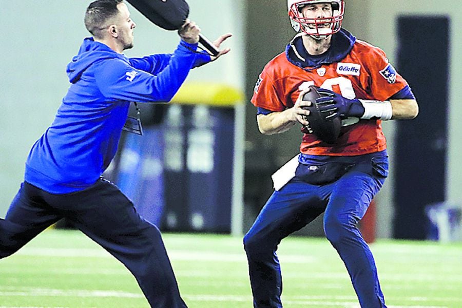 New England Patriots quarterback Tom Brady looks to pass during NFL f