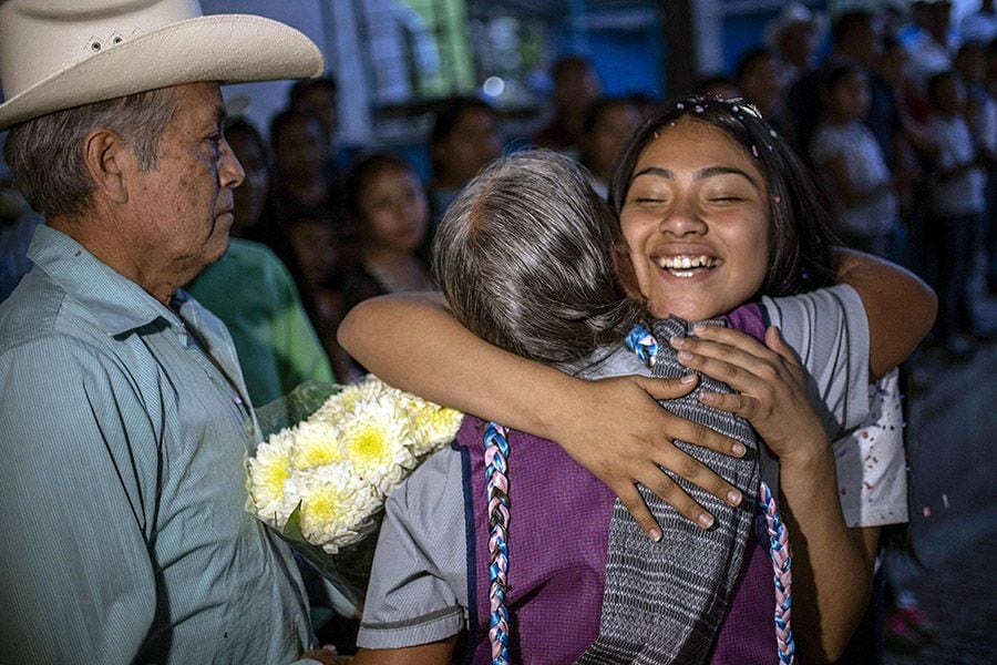 US-born Mexican Kelly Nape (R) embraces her grandmother during a fami