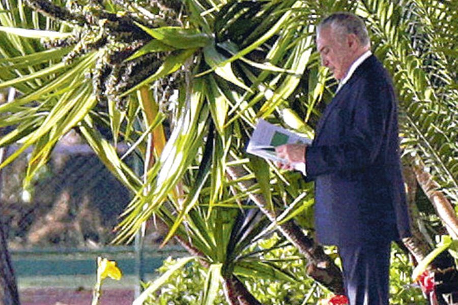 brazils-president-michel-temer-leaves-the-37747201