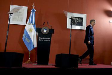 Argentina President Mauricio Macri leaves after a press conference at