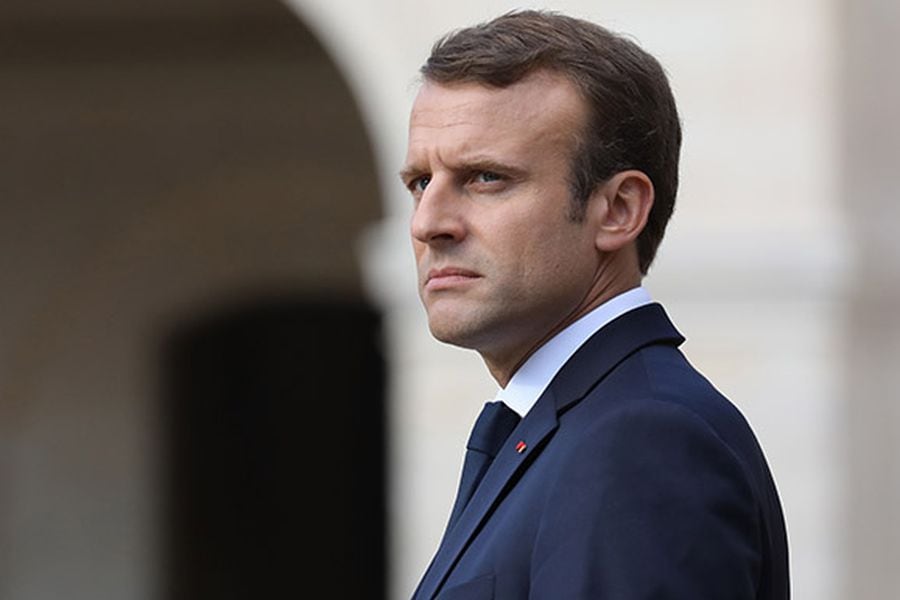 French President Emmanuel Macron looks on during a ceremony in tribut