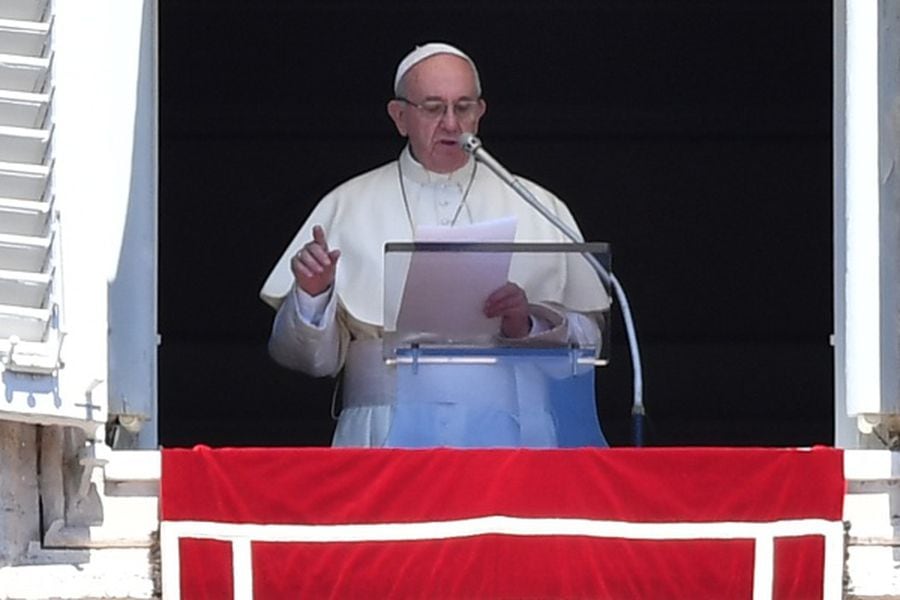 Pope Francis addresses the crowd from the window of the apostolic pal