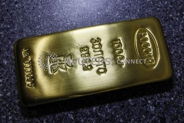 A marked ingot of 99.99 percent pure gold is placed in a cart at a plant of Krastsvetmet in Krasnoyarsk