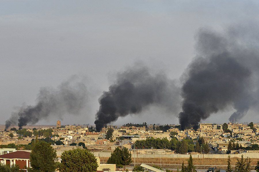 Smoke-rises-from-the-Syrian-border-town-of-Ras-al-Ain-as-it-is-pictured-from-the-Turkish-town-of-Ceylanpinar-in-Sanliurfa-province-(46976007)