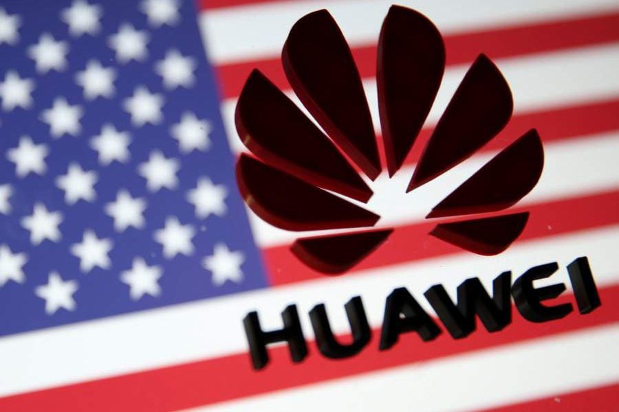 FILE PHOTO - A 3D printed Huawei logo is placed on glass above a displayed U.S. flag in this illustration