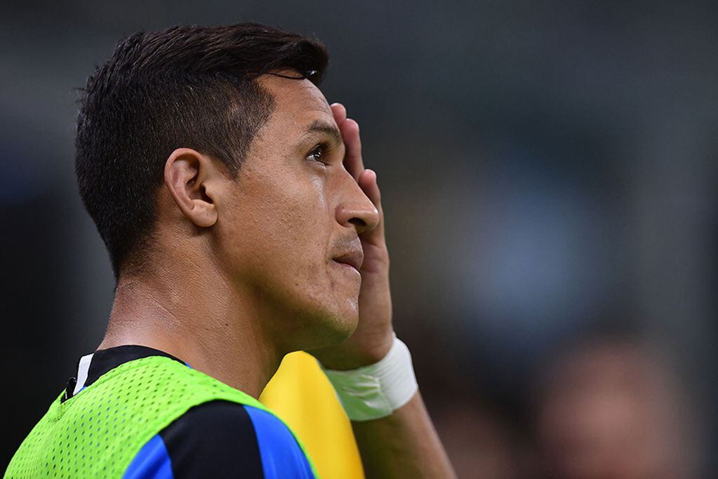 Inter Milan's Chilean forward Alexis Sanchez looks on from the touchline during the Italian Serie A football match Inter Milan vs Udinese on September 14, 2019 at the San Siro stadium in Milan. / AFP / Miguel MEDINA