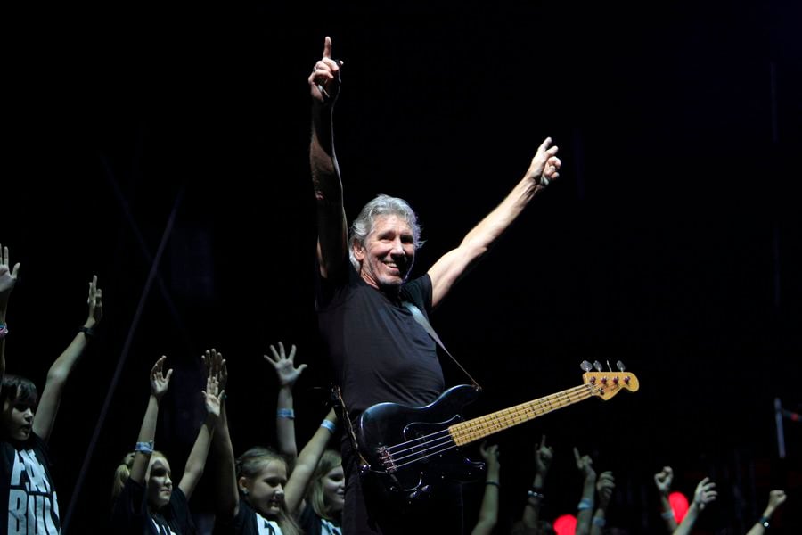 Former Pink Floyd co-founder and bass guitarist Waters performs with a Romanian children choir during "The Wall" tour live concert in Bucharest