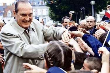 FILE-PHOTO_-File-photo-of-French-President-Jacques-Chirac--shaking-hands-with-residents-of-(46842733)