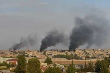 Smoke rises from the Syrian border town of Ras al-Ain as it is pictured from the Turkish town of Ceylanpinar in Sanliurfa province