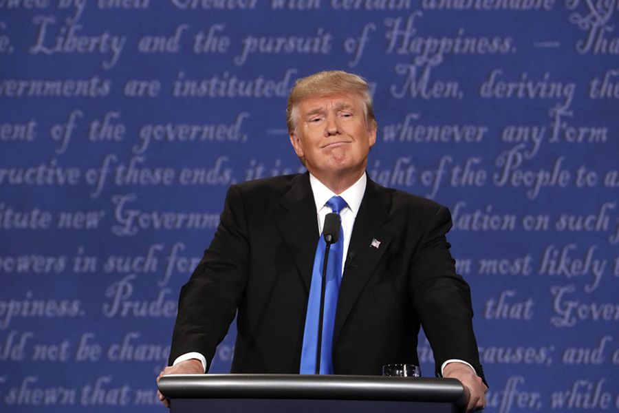 Republican U.S. presidential nominee Donald Trump listens during the first debate with Democratic U.S. presidential nominee Hillary Clinton at Hofstra University in Hempstead