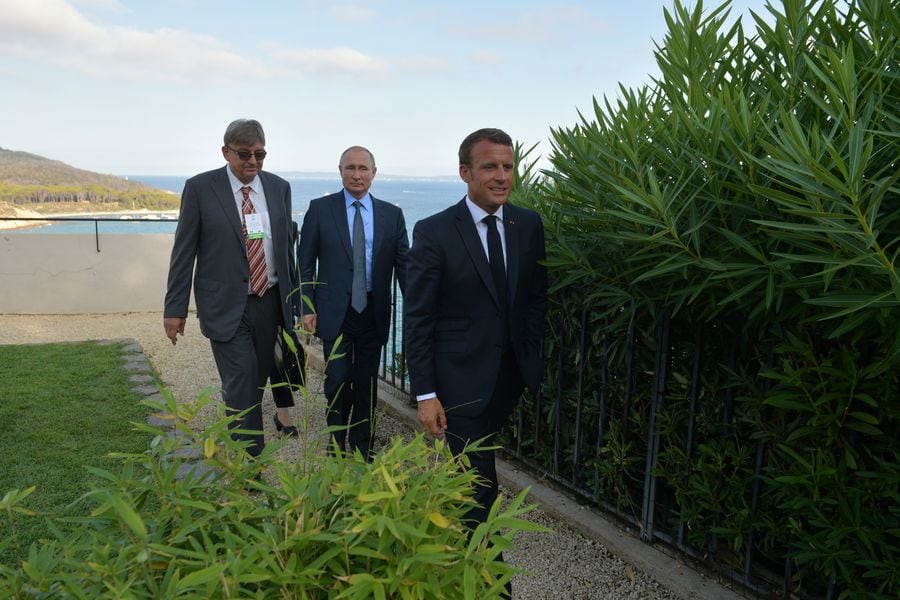 Russian President Vladimir Putin meets with French President Emmanuel Macron near the village of Bormes-les-Mimosas