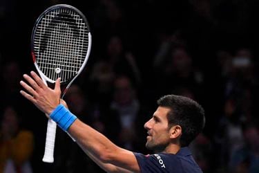 Serbia's Novak Djokovic celebrates winning his semi final match against Japan's Kei Nishikori