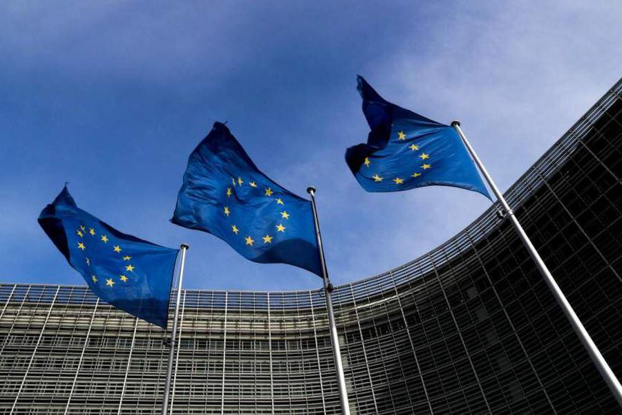 FILE PHOTO: European Union flags flutter outside the EU Commission headquarters in Brussels