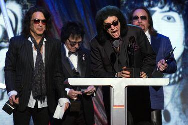 FILE PHOTO: Simmons of the rock band Kiss speaks next to fellow band members Stanley, Criss and Frehley after Kiss was inducted at 29th annual Rock and Roll Hall of Fame Induction Ceremony in Brooklyn, New York