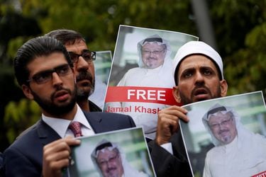 FILE PHOTO: Human rights activists and friends of Saudi journalist Khashoggi hold his pictures during a protest outside the Saudi Consulate in Istanbul