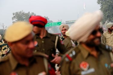 Police stand guard before the arrival of an Indian Air Force pilot, who was captured by Pakistan on Wednesday, near Wagah border, on the outskirts of the northern city of Amritsar