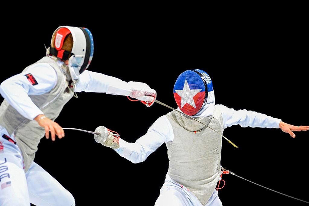US Race Imboden (L) and Chile's Gustavo Alarcon compete in the Men's Foil Individual Semifinal 2 at the Lima 2019 Pan-American Games in Lima on August 6, 2019. / AFP / Ernesto BENAVIDES