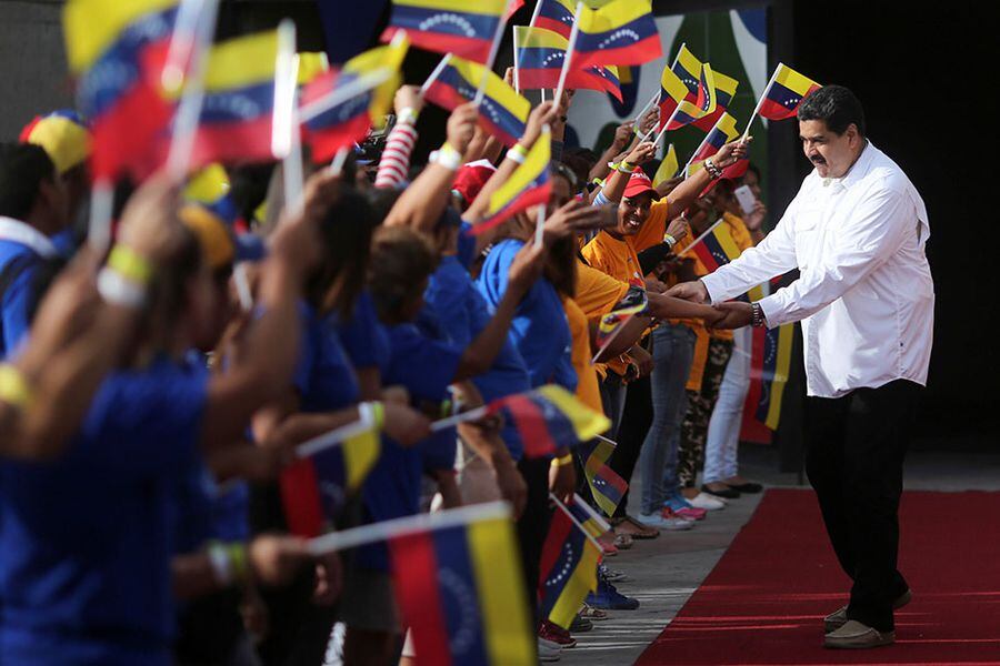 Venezuela's President Nicolas Maduro greets supporters as he arrives for an event with women at Miraflores Palace in Caracas