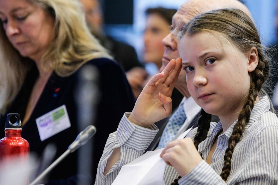 Swedish 16-years-old climate activist Greta Thunberg gestures as she