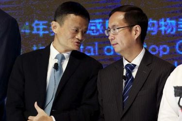 FILE PHOTO: Alibaba Founder and Chairman Jack Ma talks to CEO Daniel Zhang at NYSE Bell Ringing ceremony during Alibaba Group's 11.11 Global shopping festival in Beijing
