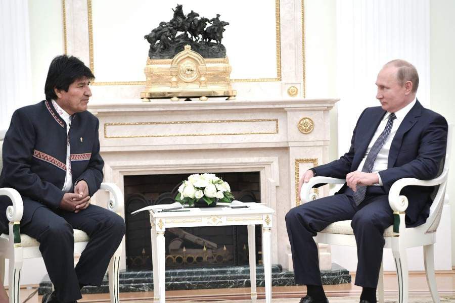 Russian President Vladimir Putin (R) meets with Bolivian President Ev