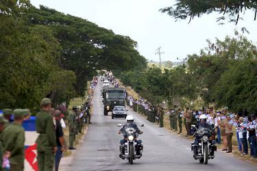The caravan carrying the ashes of Fidel Castro pass along a highway in Cardenas