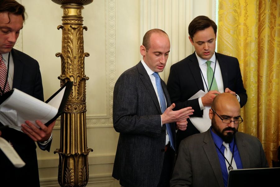 White House policy advisor Stephen Miller works with the teleprompter operators on U.S. President Donald Trump's remarks before a meeting of the National Space Council at the White House in Washington