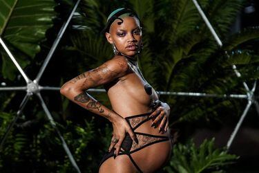 Pregnant model Slick Woods presents a creation by Rihanna during the Savage X Fenty event in New York City