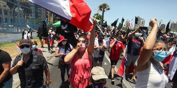 Chilean demonstrators take part in a rally against migration and delinquency, in Iquique