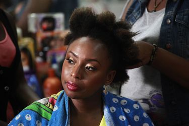 Nigerian novelist Chimamanda Ngozi Adichie sits in a salon for her hair-do in Victoria Island district in Lagos