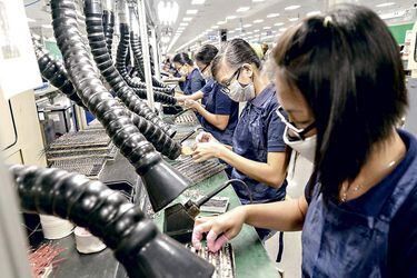 Manufacturing Calculators at a Cal-Comp Technology Factory as New Kinpo Group Philippine Unit Plans IPO