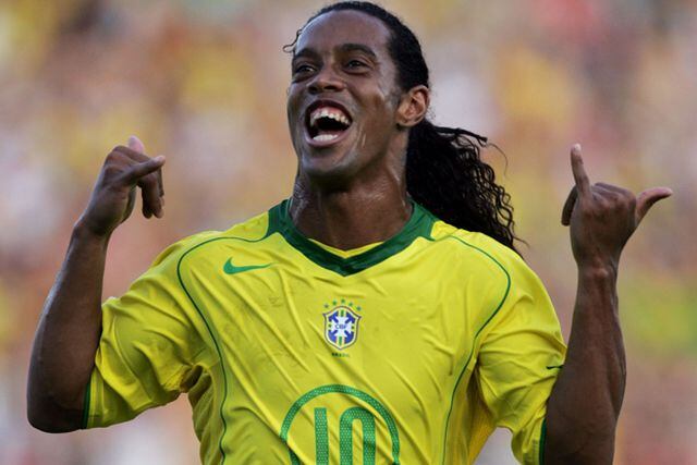 Brazil''s forward Ronaldinho celebrates after scoring on a penalty ki