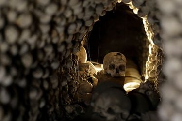 Medieval human skulls and bones are piled up at the Sedlec Ossuary in Kutna Hora