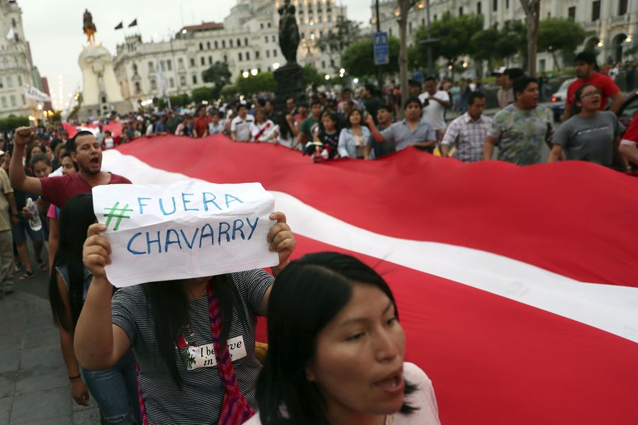 Demonstrators protest at San Martin Plaza in Lima