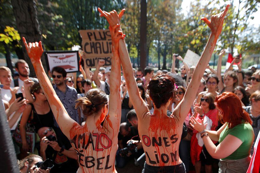 Climate activists attend a protest outside the Brazil's embassy in Paris due the wildfires at Amazon rainforest