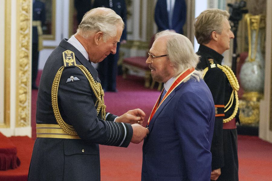 Singer and songwriter Barry Gibb talks with Prince Charles