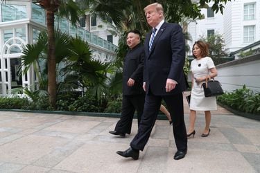 North Korea's leader Kim Jong Un and U.S. President Donald Trump walk at the Metropole hotel during the second North Korea-U.S. summit in Hanoi