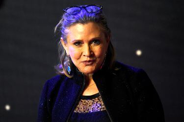 FILE PHOTO: Carrie Fisher  poses for cameras as she arrives at the European Premiere of Star Wars, The Force Awakens in Leicester Square, London